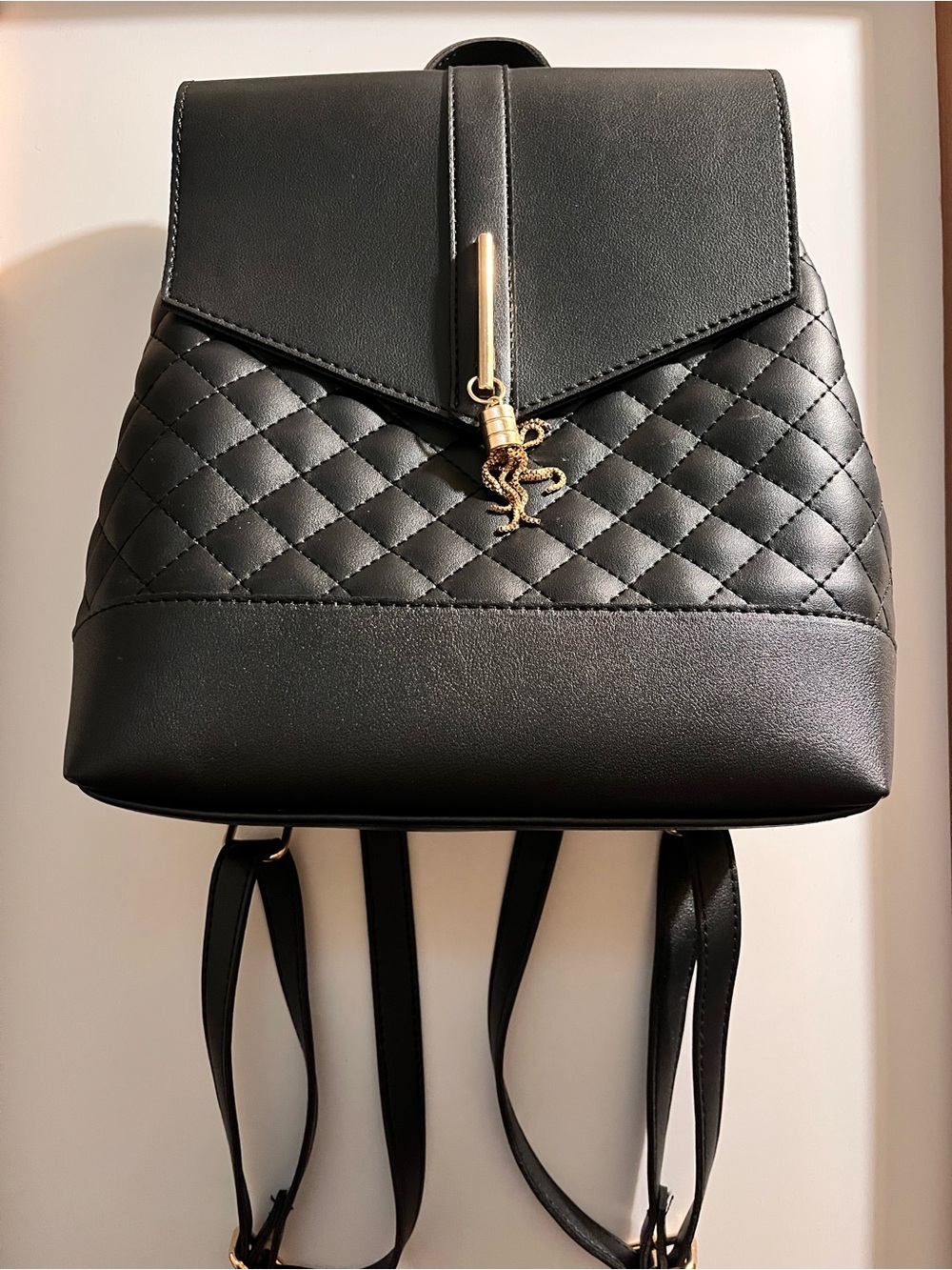 Black Quilted Backpack with Gold Charm